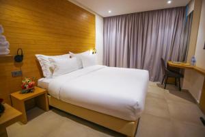 Voodi või voodid majutusasutuse FAHO Hôtel toas