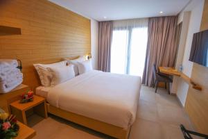Voodi või voodid majutusasutuse FAHO Hôtel toas