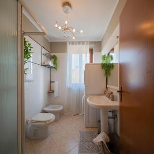 a bathroom with a toilet and a sink at Italian Experience-La Casa Del Saggio in Pavia