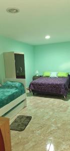 a bedroom with two beds in a room at Departamento Dulce Adelina I - Zona Céntrica in Río Grande