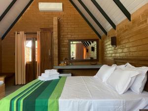 Postel nebo postele na pokoji v ubytování Ayubowan Nature Cottage + 37 fotografií