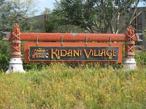 a sign for a indian village in a field at Disney's Animal Kingdom Villas - Kidani Village in Orlando