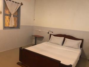 Postel nebo postele na pokoji v ubytování Dorm Can Tho