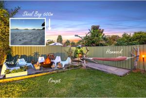 a picture of a backyard with chairs and a fence at Kookaburra Krib Walk 2 Little Beach and Shoal Bay in Nelson Bay