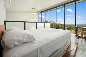 Ένα ή περισσότερα κρεβάτια σε δωμάτιο στο Junglo Resort and Spa +287 φωτογραφίες