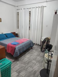 Postel nebo postele na pokoji v ubytování Departamento Casa Gaston + 1 fotografie