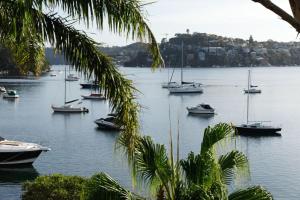 a group of boats in a body of water at Stone 1Bedroom Cottage in Sydney