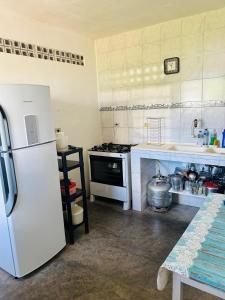 Kuchyň nebo kuchyňský kout v ubytování Gondim Residence