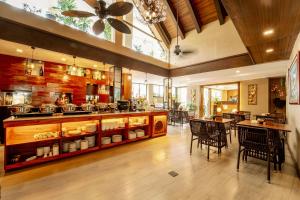 a large room with a kitchen with tables and chairs at Boracay Haven Resort in Boracay