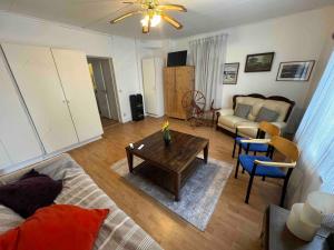 a living room with a couch and a coffee table at Krylbo Avesta in big wooden house in Krylbo