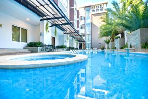 a swimming pool in the middle of a building at Boracay Haven Suites in Boracay