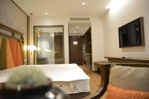 TV a/nebo společenská místnost v ubytování APEC MŨI NÉ MANDALA