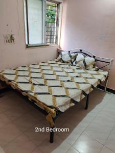 Postel nebo postele na pokoji v ubytování Cozy Stay near Kolhapur Railway Station + 8 fotografií