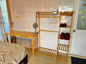 Postel nebo postele na pokoji v ubytování Jampathong mansion