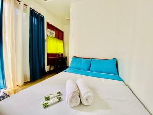 Ένα ή περισσότερα κρεβάτια σε δωμάτιο στο Sudla Siargao Hostel