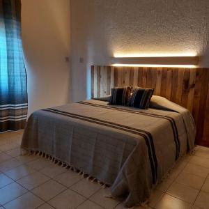 Ένα ή περισσότερα κρεβάτια σε δωμάτιο στο Departamento Yotao