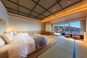 Postelja oz. postelje v sobi nastanitve Atami Korakuen Hotel
