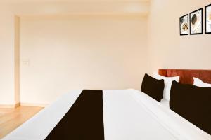 Ένα ή περισσότερα κρεβάτια σε δωμάτιο στο Hotel O AR SUITES