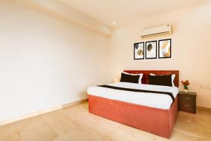 Ένα ή περισσότερα κρεβάτια σε δωμάτιο στο Hotel O AR SUITES +23 φωτογραφίες