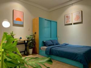 Ένα ή περισσότερα κρεβάτια σε δωμάτιο στο Alis Homestay