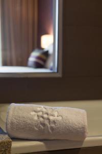 a roll of toilet paper sitting on top of a counter at Madre de Água Hotel Rural de Charme in Gouveia +38 photos