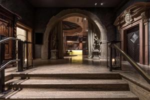 a hallway with stairs and an entrance to a building at Best Western Premier Hotel Rebstock in Würzburg
