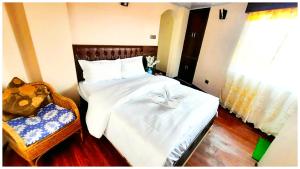 Postel nebo postele na pokoji v ubytování A PREMIUM HOTEL OLIVE BRANCH DARJEELING Near Gurudwara - Best Hotel In Darjeelig