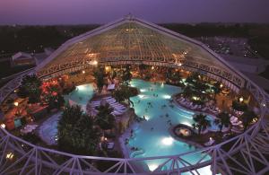 a view of a water park at night at Best Western Plus Parkhotel Erding in Erding