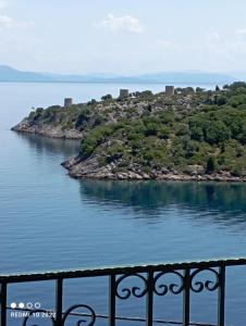 an island in the middle of a body of water at Aprilis Apartments 2 in Kiónion +38 photos
