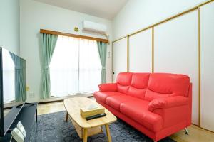Televisyen dan/atau pusat hiburan di さくらハウス - SAKURA HOUSE 40mins from Disneyland