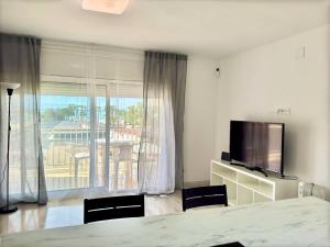 Una televisión o centro de entretenimiento en Apartsalou Barbastre