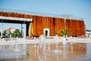 a water fountain in front of a large building at Best Western Plus Hotel Ostertor in Bad Salzuflen