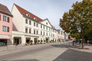 an empty street in a town with buildings at Best Western Premier Grand Hotel Russischer Hof in Weimar