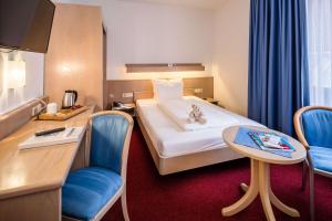 Postel nebo postele na pokoji v ubytování Best Western Hotel Heide