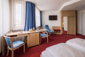TV a/nebo společenská místnost v ubytování Best Western Hotel Heide