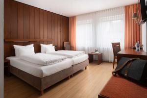 Postel nebo postele na pokoji v ubytování Best Western Hotel Heide