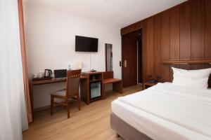 TV a/nebo společenská místnost v ubytování Best Western Hotel Heide