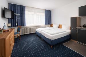 Postel nebo postele na pokoji v ubytování Best Western Hotel Heide