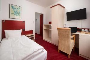 TV a/nebo společenská místnost v ubytování Best Western Hotel Heide