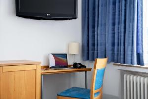 TV a/nebo společenská místnost v ubytování Best Western Hotel Heide
