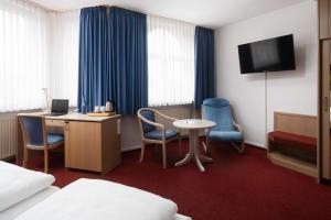 TV a/nebo společenská místnost v ubytování Best Western Hotel Heide