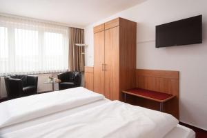 TV a/nebo společenská místnost v ubytování Best Western Hotel Heide