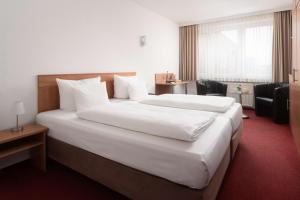 Postel nebo postele na pokoji v ubytování Best Western Hotel Heide