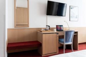 TV a/nebo společenská místnost v ubytování Best Western Hotel Heide