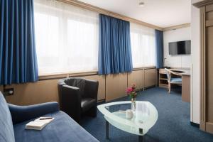 TV a/nebo společenská místnost v ubytování Best Western Hotel Heide