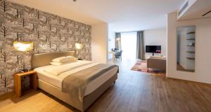 Postel nebo postele na pokoji v ubytování Best Western Plus iO Hotel