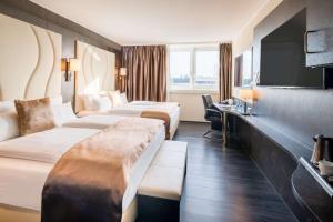 Postel nebo postele na pokoji v ubytování Best Western Plus Plaza Hotel Darmstadt + 37 fotografií