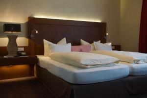 Ein Bett oder Betten in einem Zimmer der Unterkunft Best Western Hotel Brunnenhof
