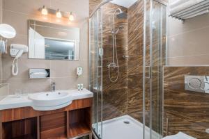 Kúpeľňa v ubytovaní Best Western Plus Celebrity Suites