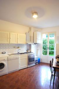 a kitchen with a sink and a dishwasher at Sivori Apartment in Bonassola